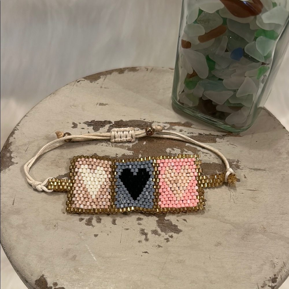 Handcrafted Beaded Bracelet with Gold and Pink Accents